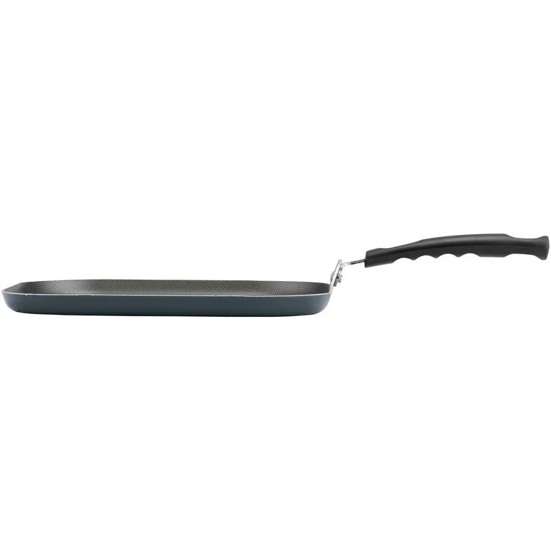 Black frying pan with a handle on a white background