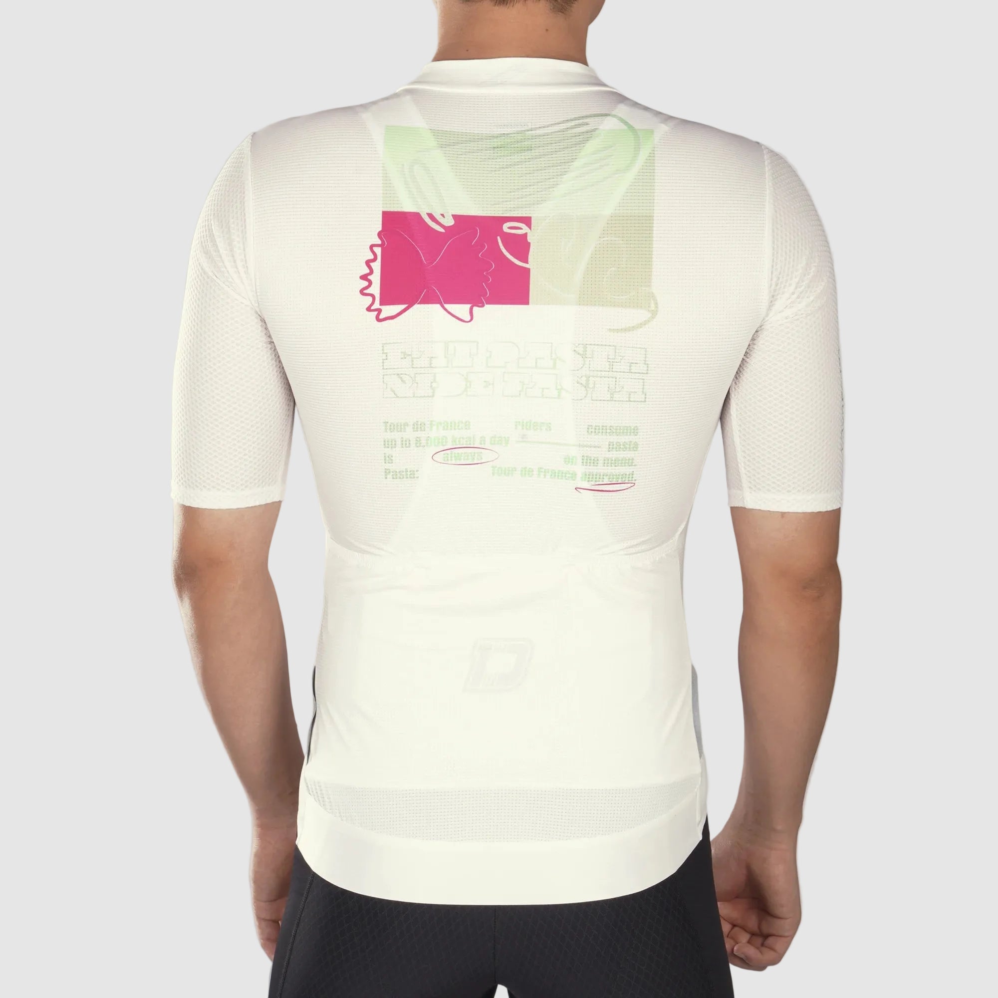 Person wearing a white athletic shirt with pink and green design on the back, on a gray background.