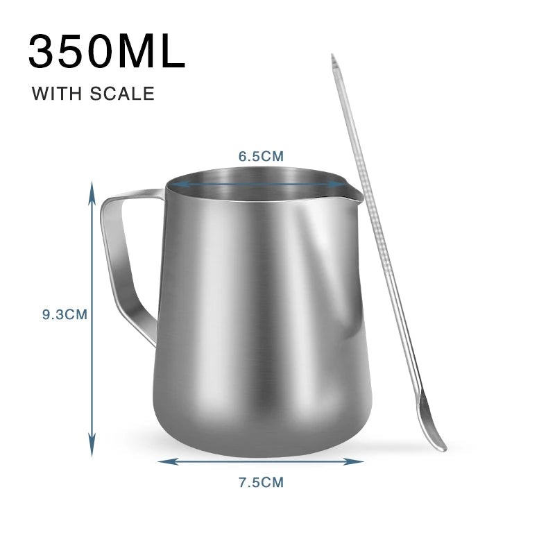 Stainless steel milk pitcher with measurements and a spoon on a white background