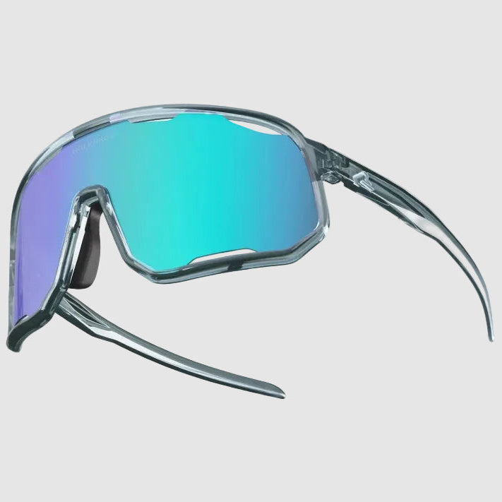 Sunglasses with a reflective turquoise lens on a light gray background