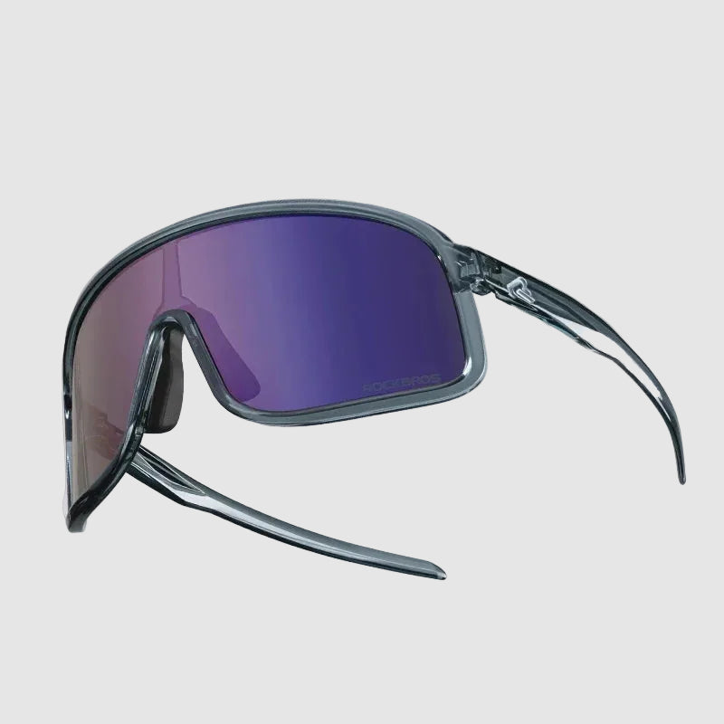 Sunglasses with purple lenses and black frames on a light gray background