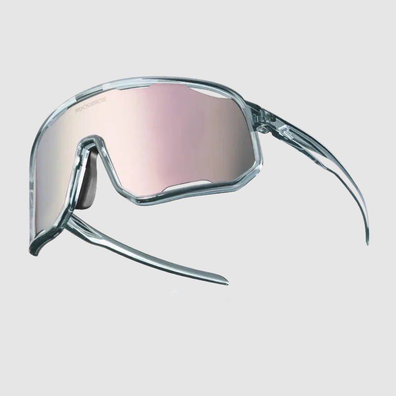 Polarized sunglasses with clear gray frame and pink lenses, featuring additional lenses and nose pads on a white background.