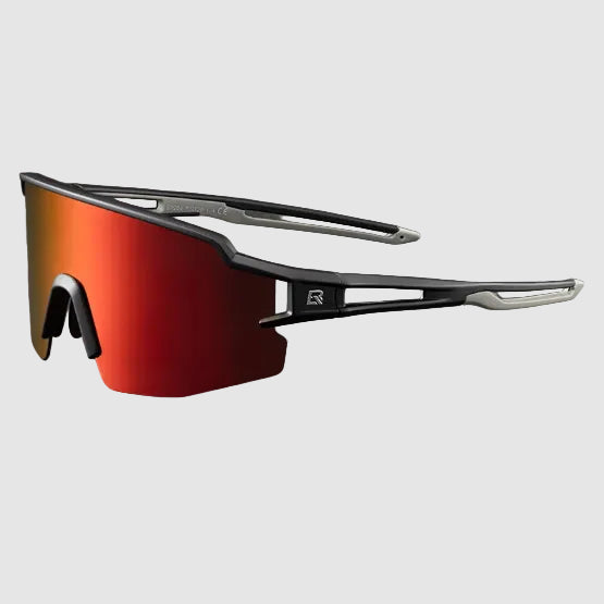 Sunglasses with red lenses and gray sand frame on a dark background, featuring additional accessories.