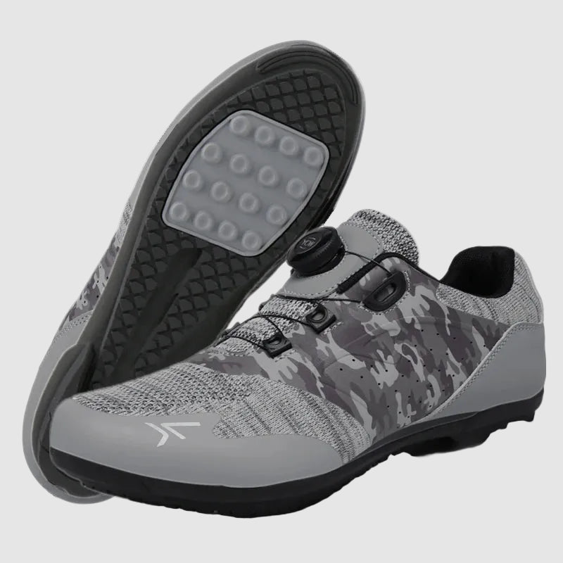 Gray and black camouflage shoes with a visible brand logo on a white background