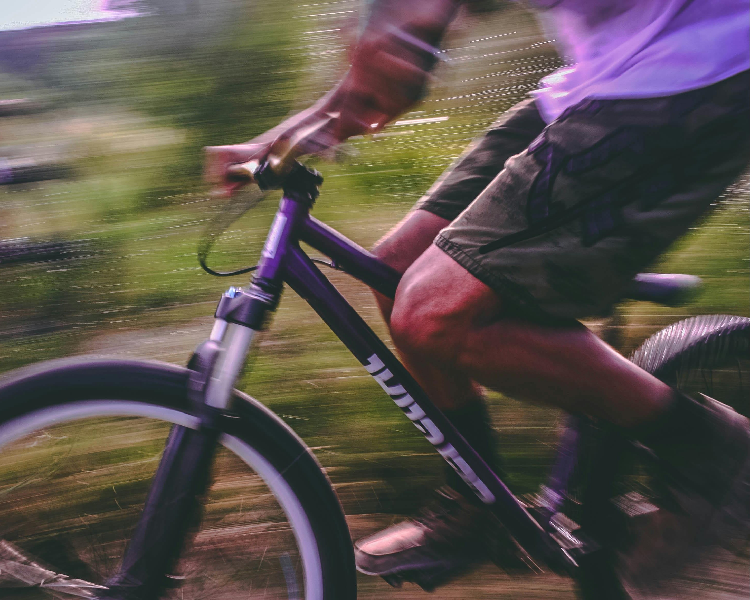 Person riding a bicycle with blurred background